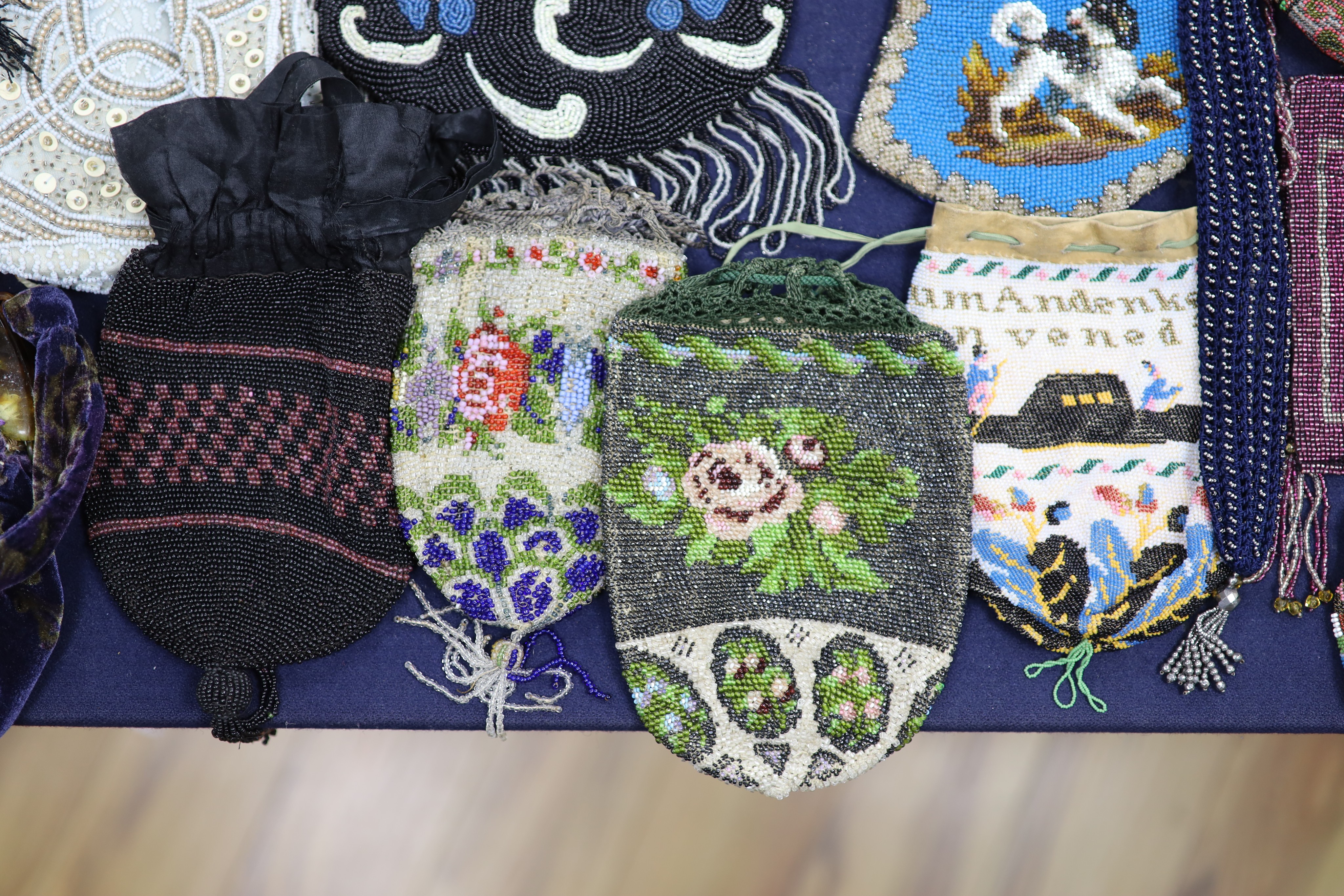 A collection of approximately fifty Victorian and later beadwork, white metal and fabric purses etc.